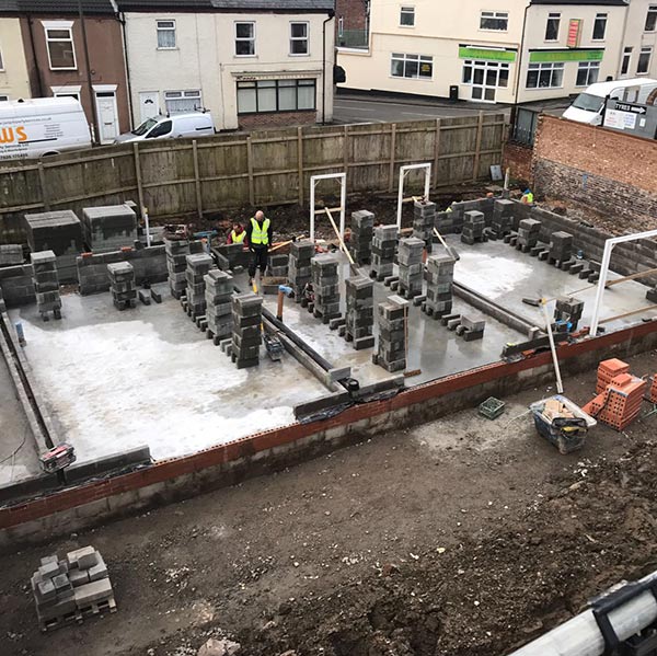 New house with foundations being laid