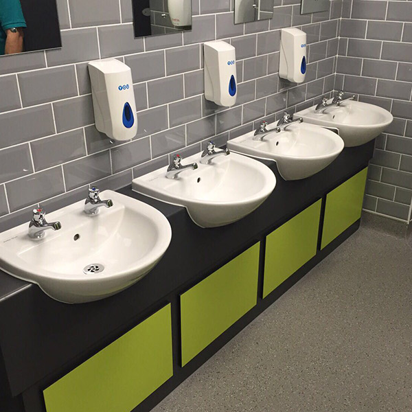 Four new wash basins in a toilet block