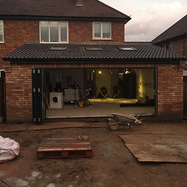 Kitchen in extension with bi-folding doors in progess