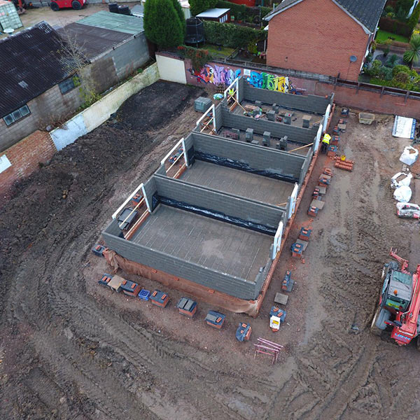 Arial view of two new houses that are half built