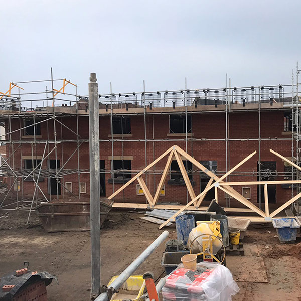 Houses nearly built but with no roof