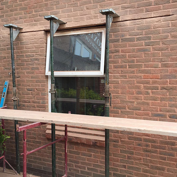 Window being removed from an external wall